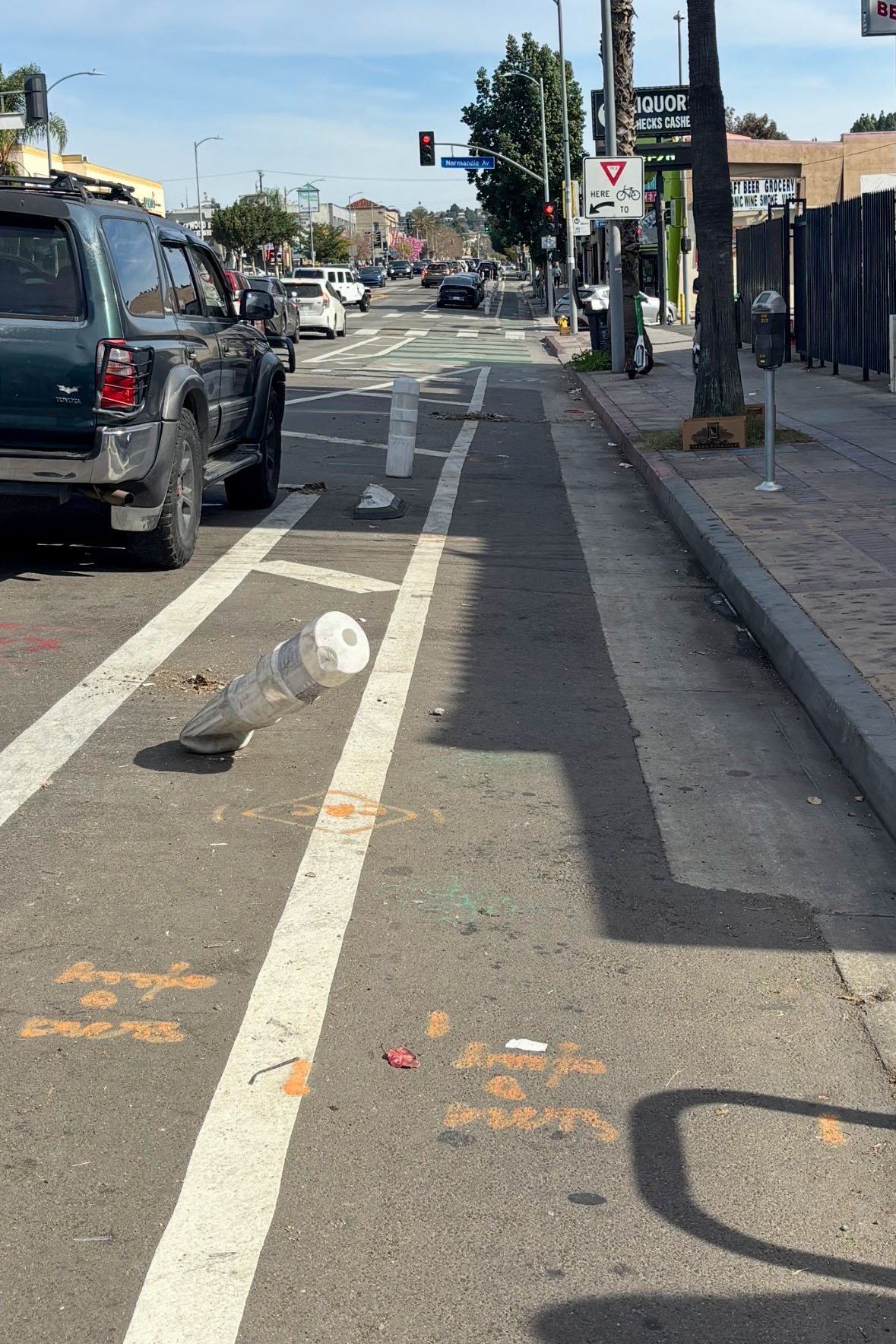 An example of a damaged bollard that was reported for leaning into the lane and creating a potential safety hazard for cyclists.