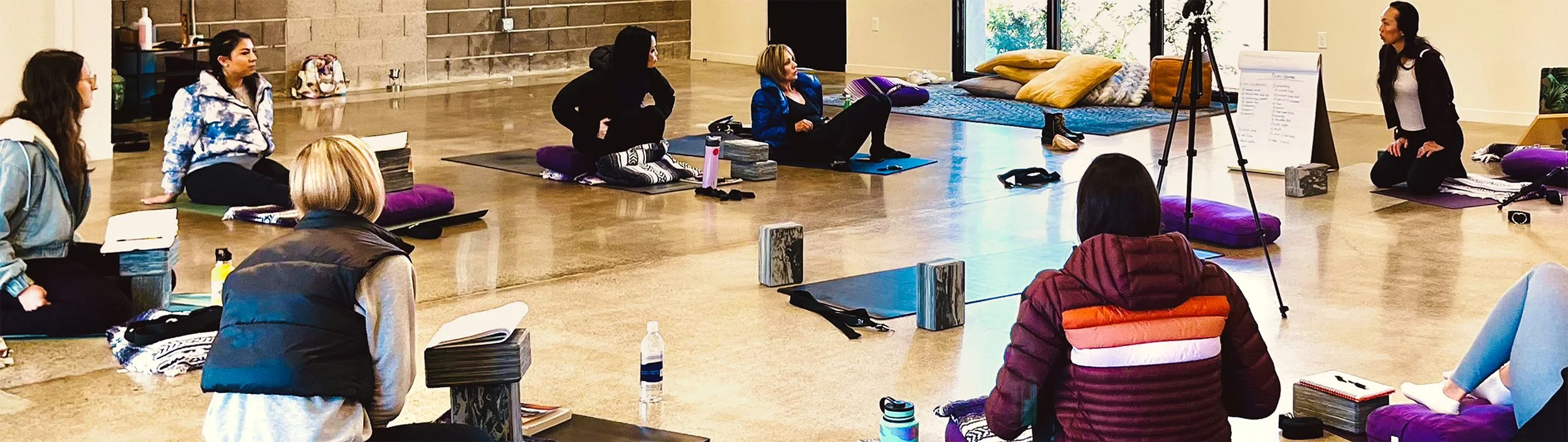 Students in a yoga teacher training class with Nikki Wong at Crave Yoga in Mountain View