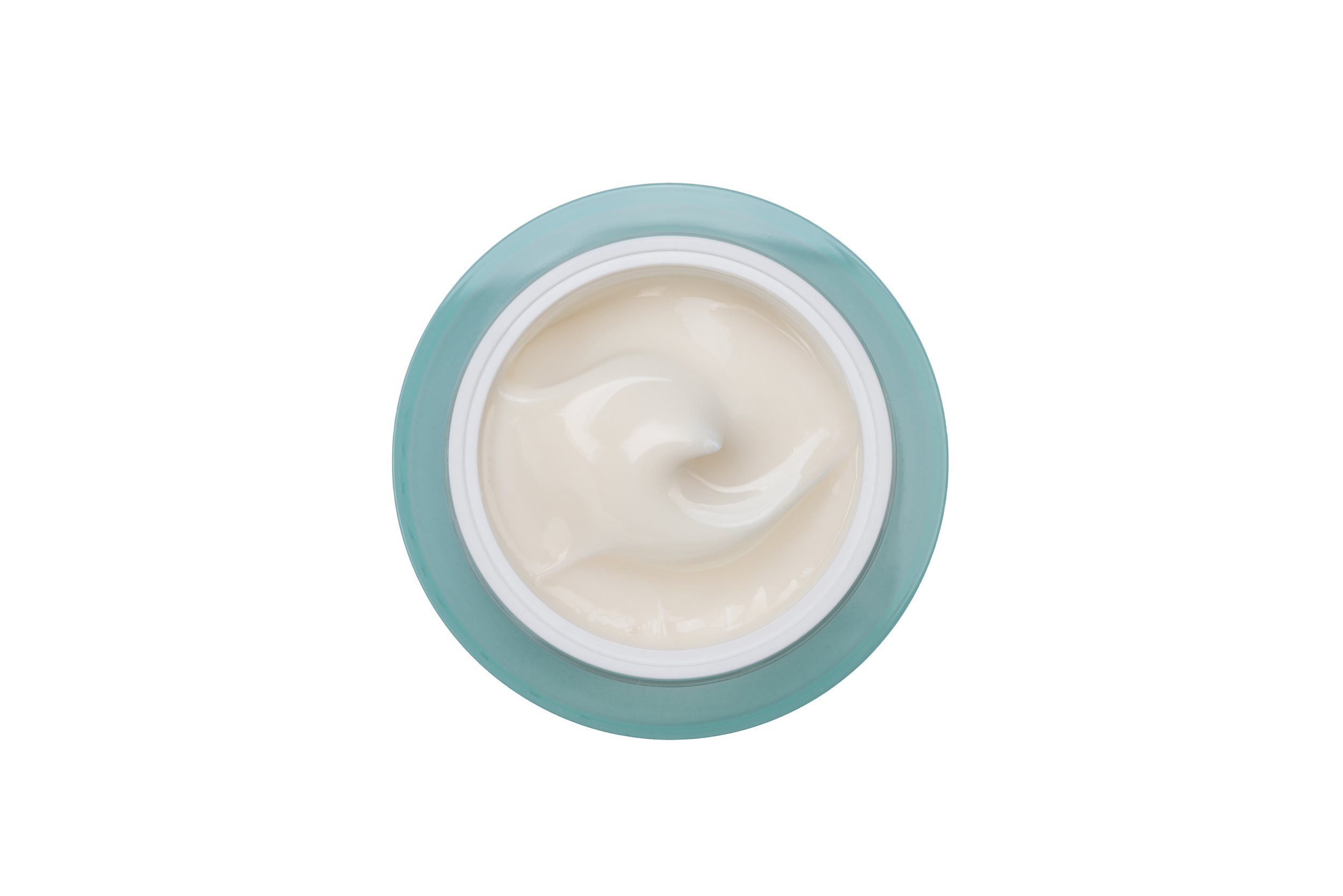 Top view of an open jar of white cream with a pale blue lid.