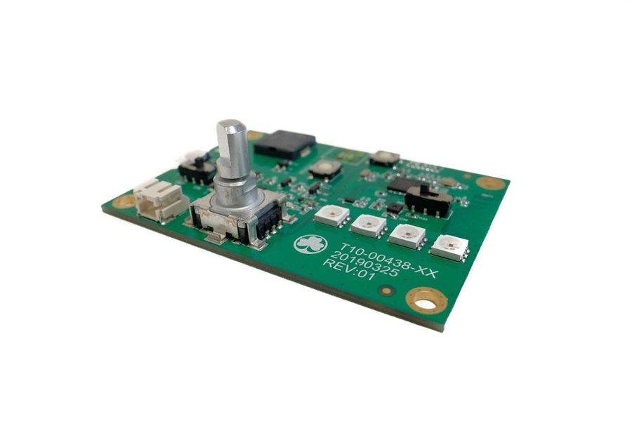 Green electronic circuit board with components and connectors viewed from an angle