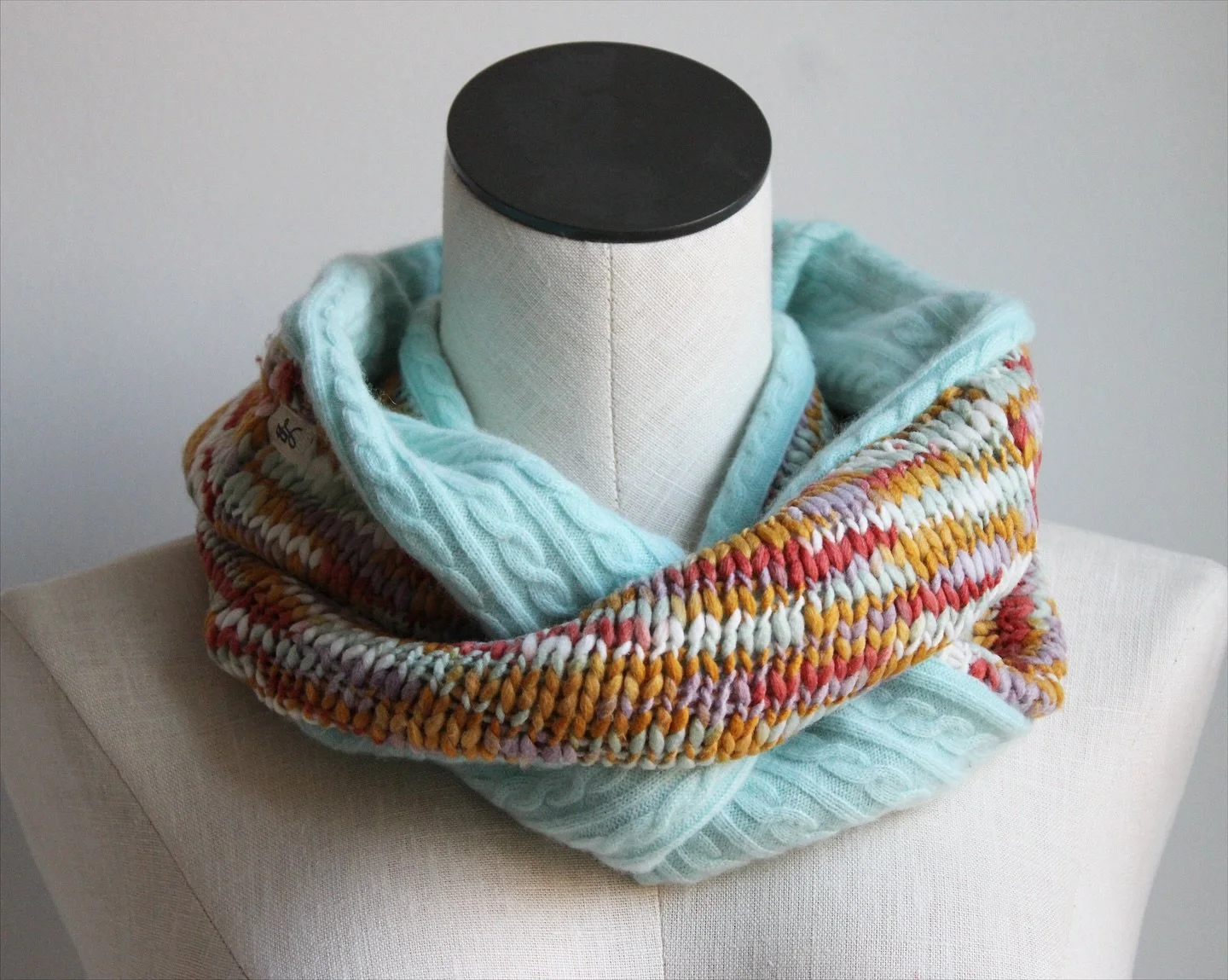 Meet Mint Sunrise 🌸✨ She&rsquo;s bringing a little hint of spring into the cozy layers of fall and winter. A soft cashmere lining + chunky knit outside = the perfect up-cycled hug for your neck. A bit more narrow than our other infinity scarves &mda