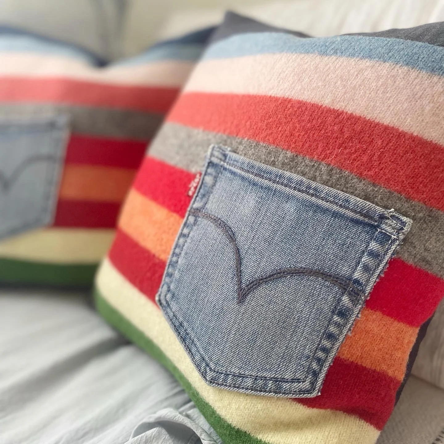 ✨ Studio Pillow Alert ✨

This one-of-a-kind pillow cover is handmade from all up-cycled materials &mdash; a soft cashmere sweater, vintage Levi&rsquo;s denim, an original jean pocket, two cowboy button snaps, and the back side of a cotton hand-dyed n