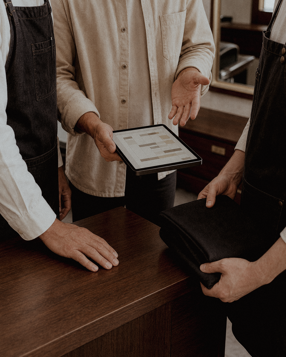house manager holding tablet meeting