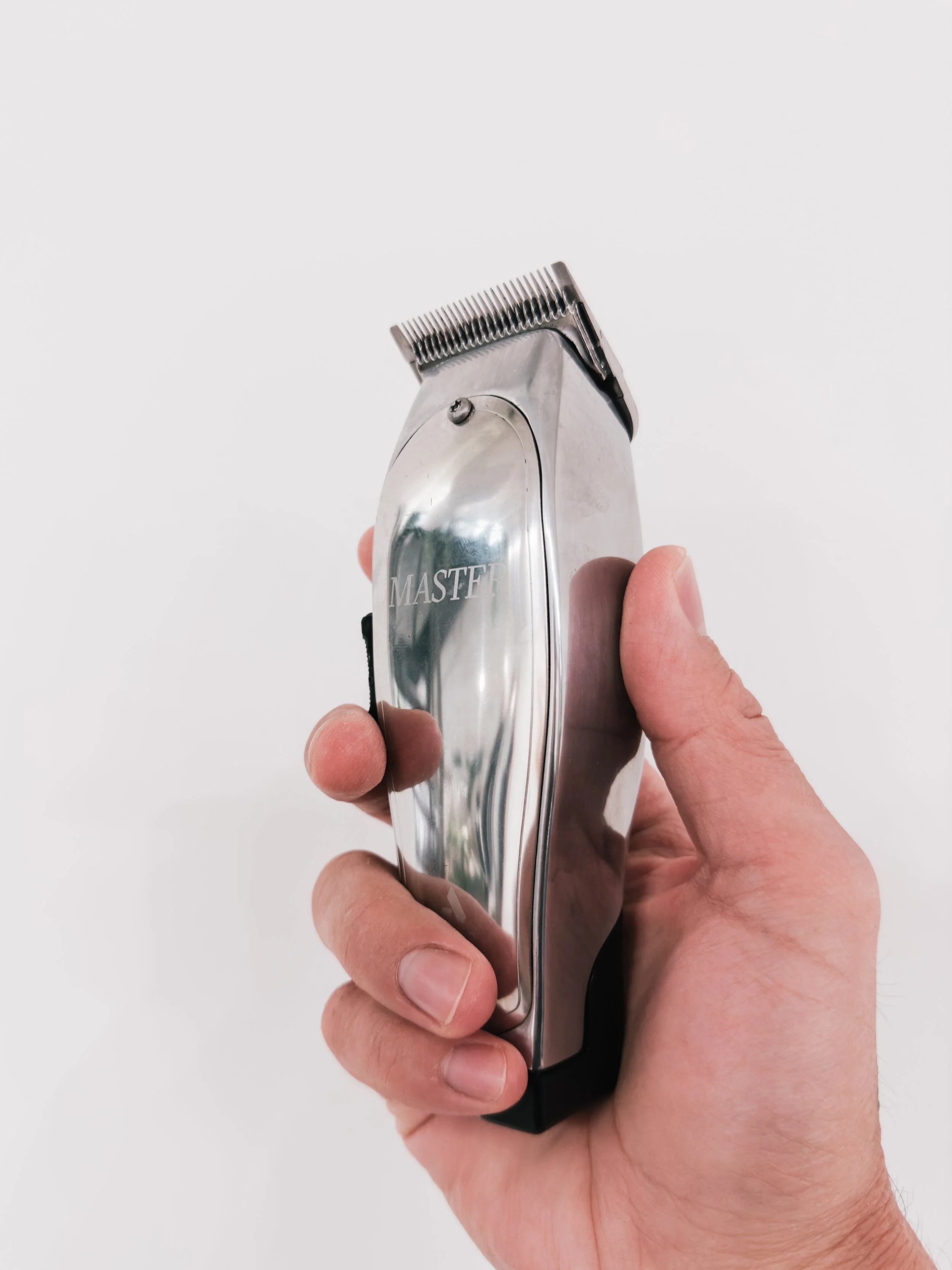 andis master clipper on white background
