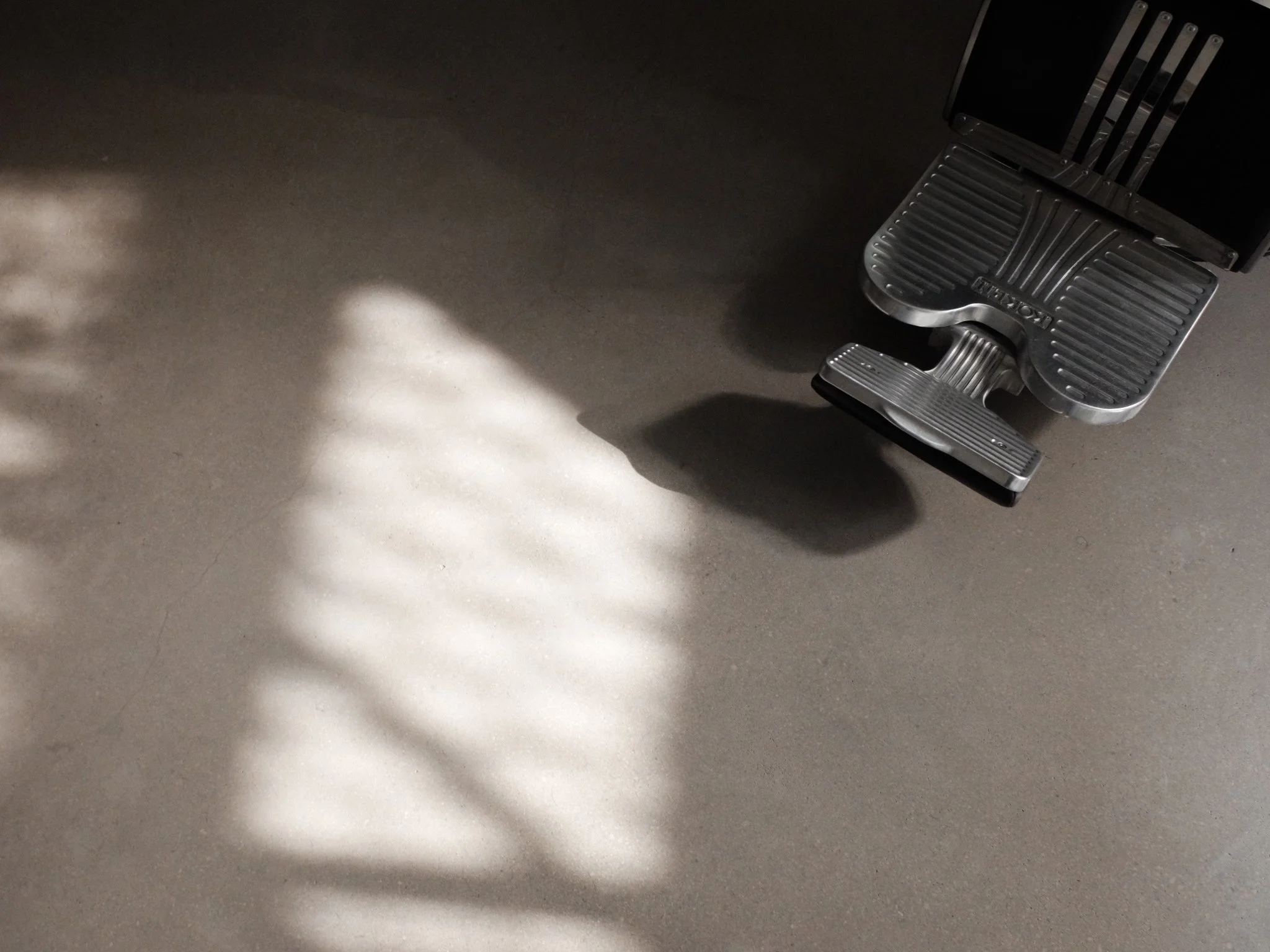 barber chair light concrete floors taker Belmont