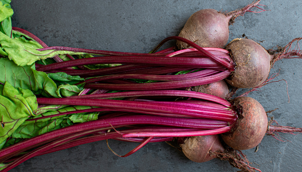 BEETS - RUBY QUEEN: Ruby Queen beets are round with smooth skin and shoulders and have a fine, buttery texture when properly cooked. The 10-12 inch tops are dull green with maroon veining. Performs well in poor soil and holds their shape well when cr