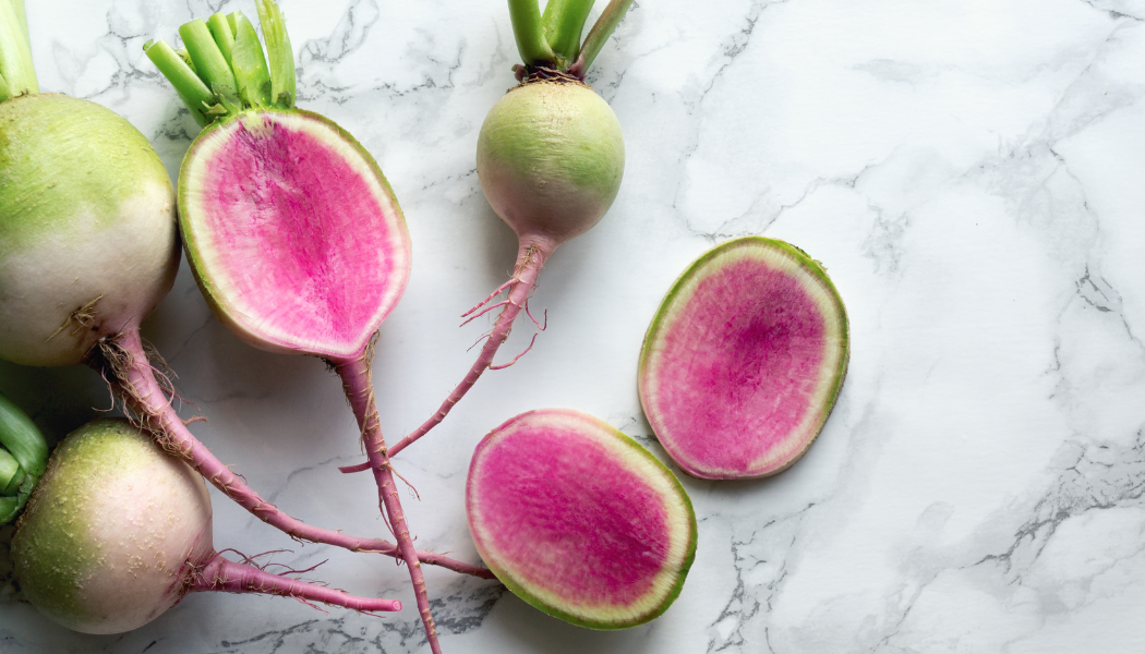 RADISH, WATERMELON: Unique watermelon-colored radish with a crisp sweet flesh. Light green to white outside deepens in color when exposed to sunlight, giving this radish its namesake. 