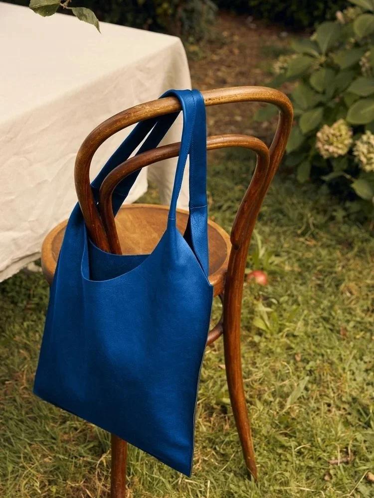Rooted in indigo, rising beyond. It&rsquo;s time to BLOOM anyway. Our limited edition Minimal Tote Bag is ready to rise with you, beyond limits, beyond doubt.

Now available (link in bio) 

_
#maraicollections #workthatreconnects #leatherbag #indigol
