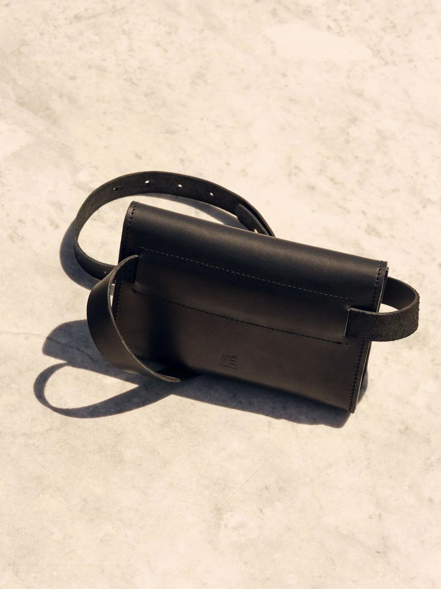 Our new sling bag.

Crafted from vegetable-tanned cowhide leather in the Canton of Bern, it combines a clear form, a single main compartment and the idea of carrying only what truly matters. 

It is more graphic and reduced than anything that has bee