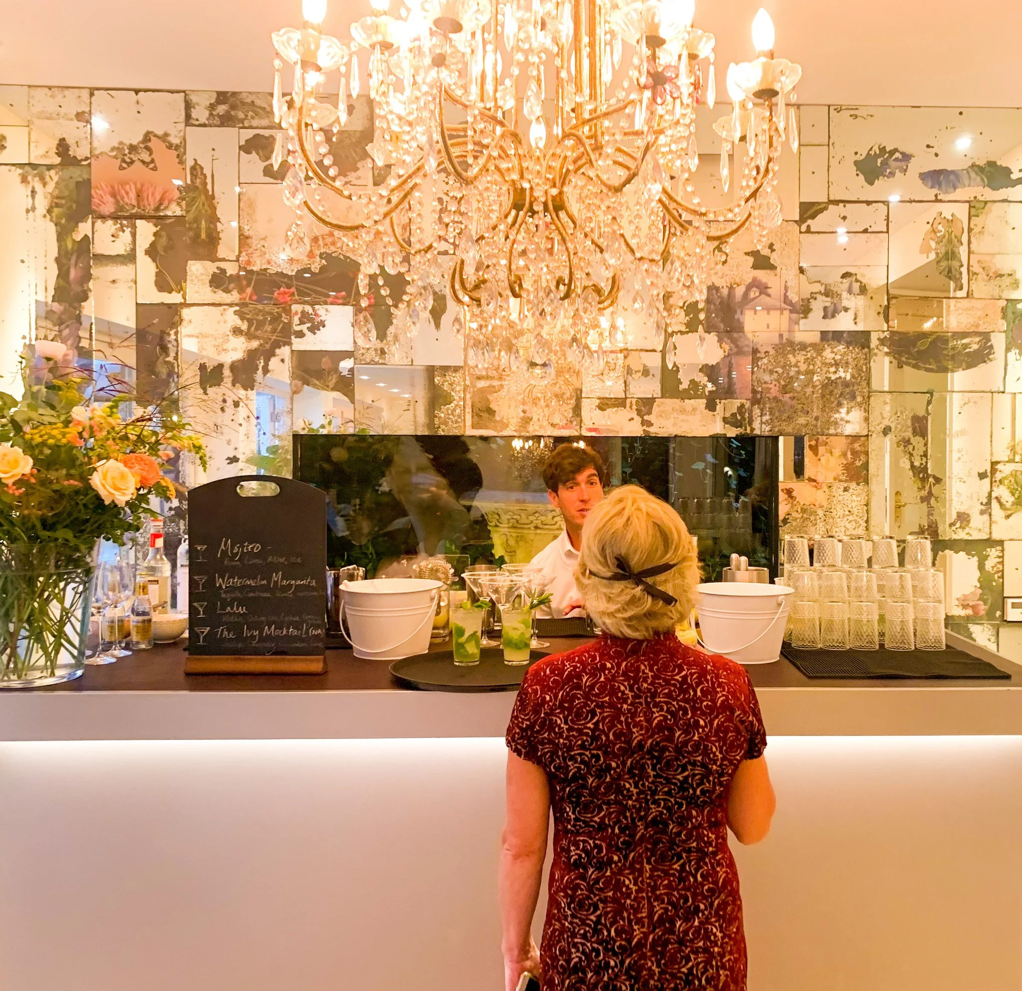 A guest being served a cocktail by Sussex's leading cocktail experience The Cocktail Tribe