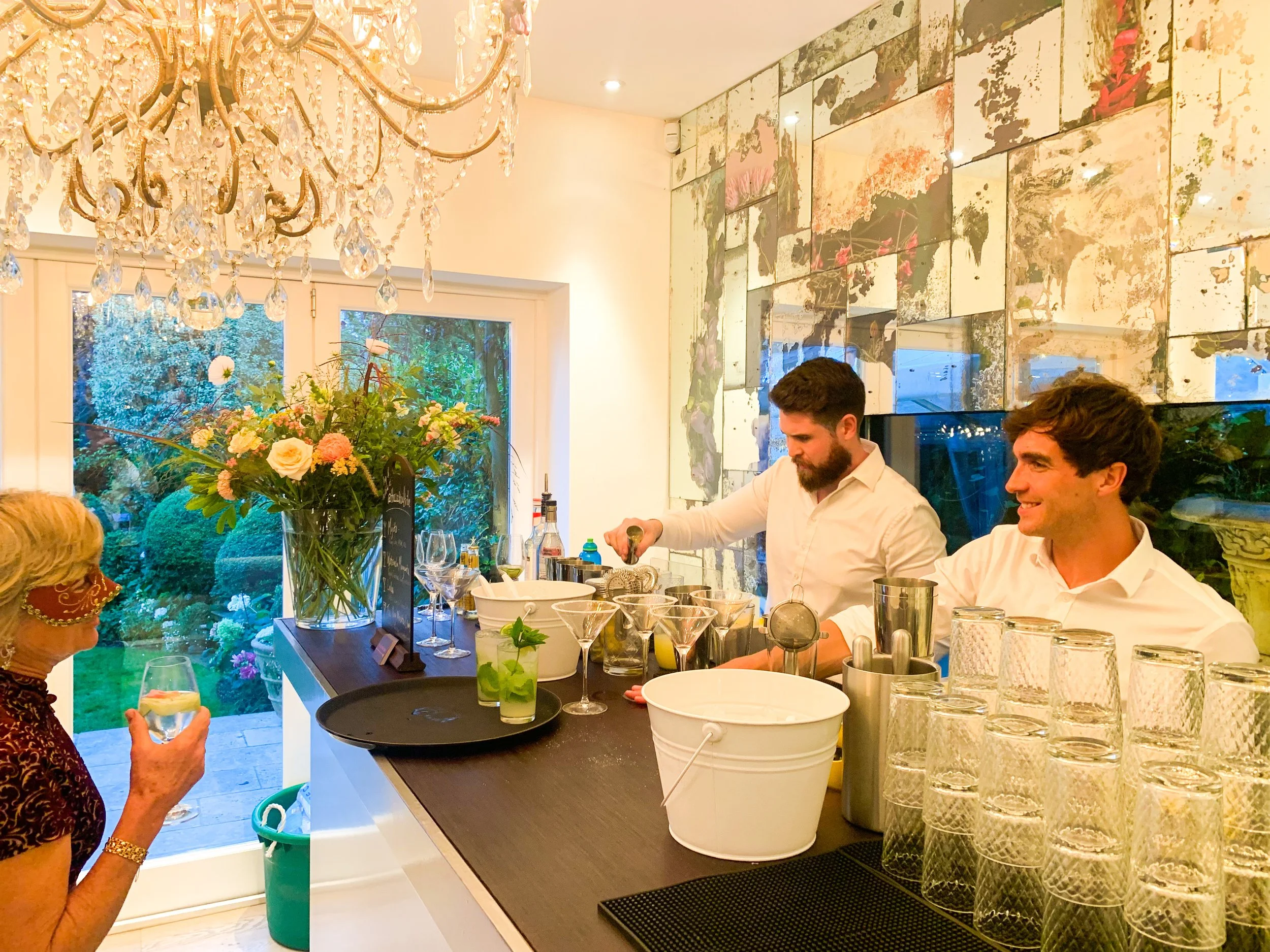 A guest being served a cocktail by Brighton's premium cocktail experience The Cocktail Tribe