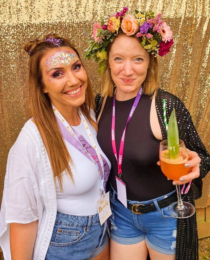 Two Hens enjoying a cocktail in a garden party Hen Do in Sussex