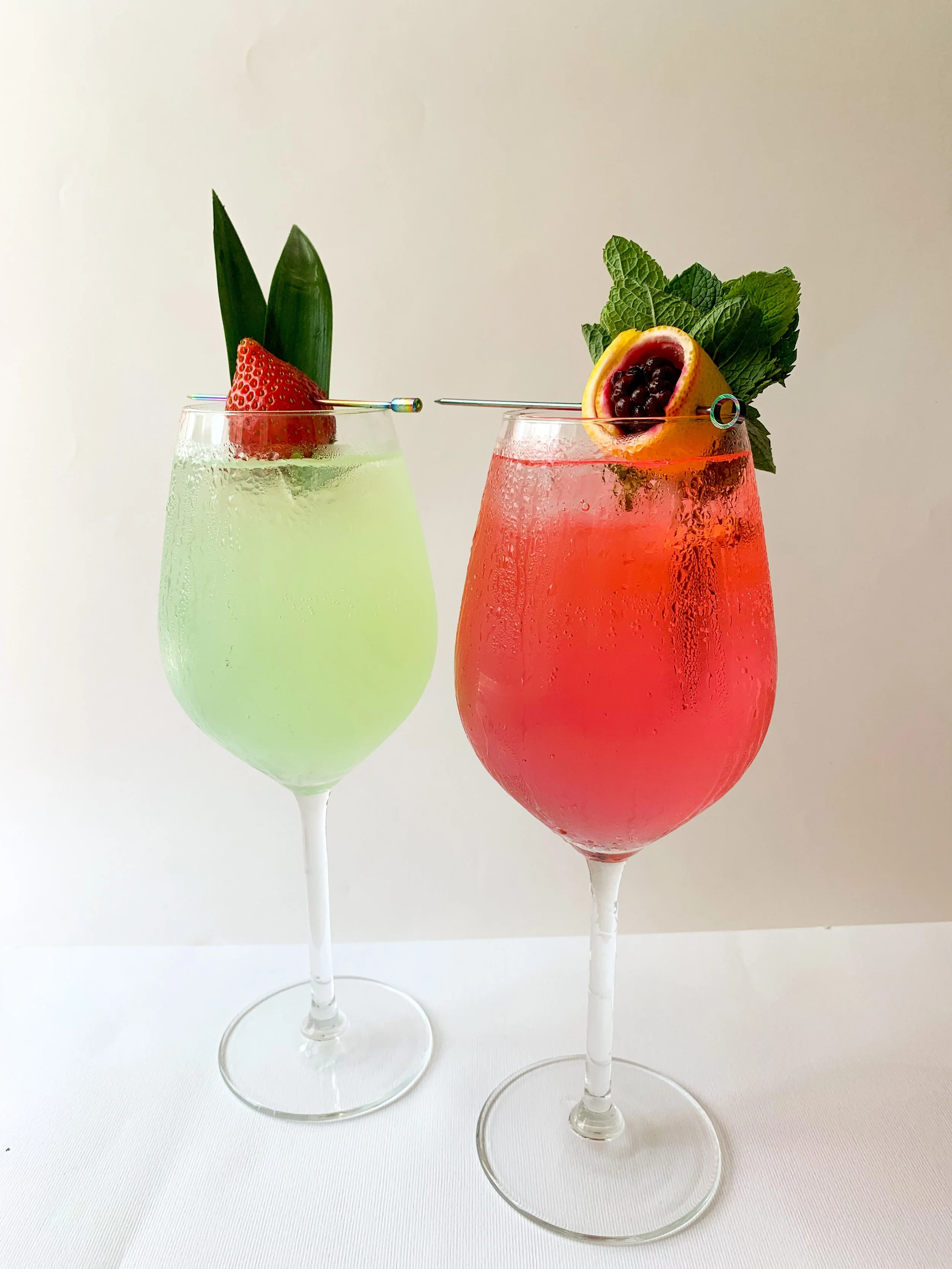 Two fruity refreshing cocktails served by Brighton's leading premium cocktail experience provider The Cocktail Tribe