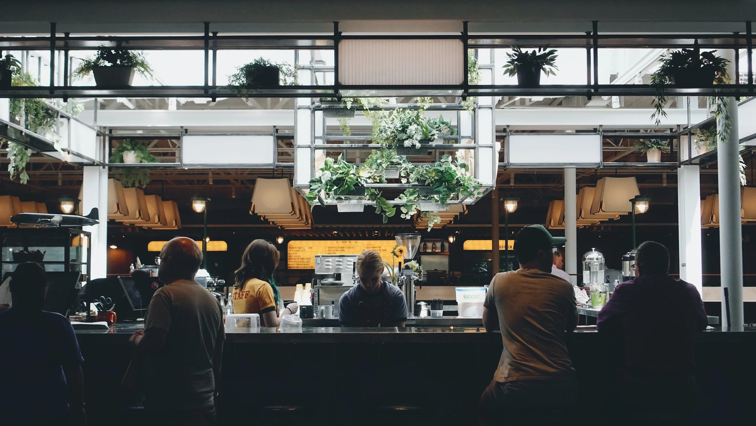 People sitting at a hotel coffee bar