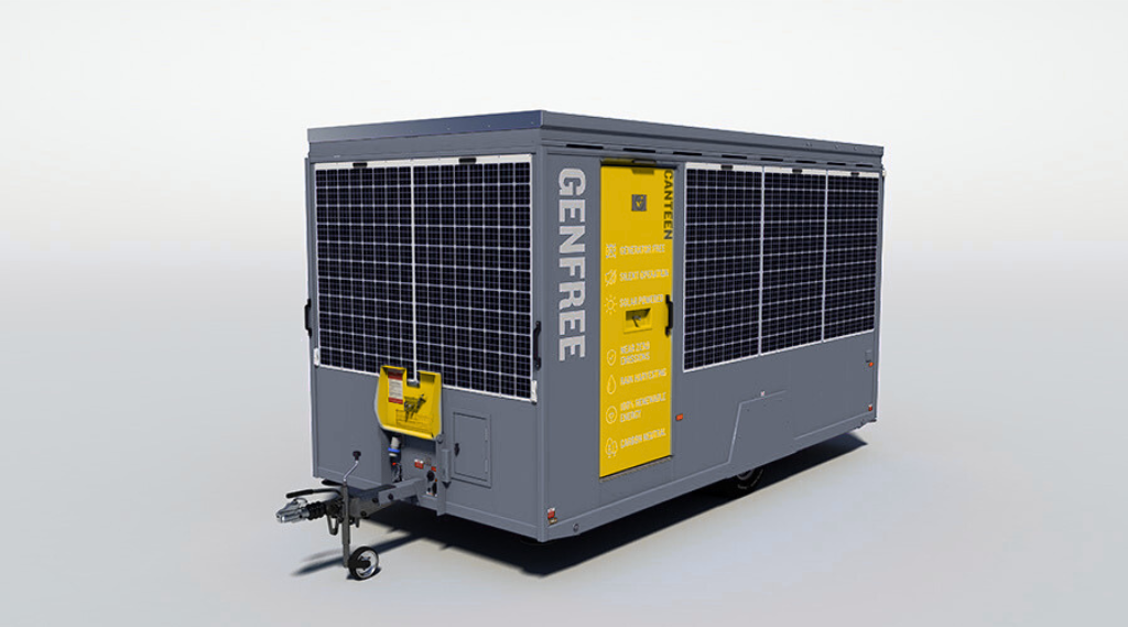 A portable refrigeration unit with solar panels on top, gray body, and yellow control panel, labeled 'GENREF.'