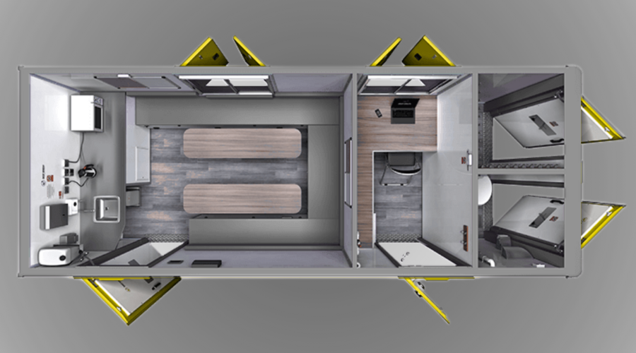 Top view of a modern mobile office or lab trailer with interior partition, two work stations, and equipment.