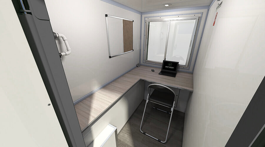 Small workspace with a desk, a chair, a window, and a monitor, inside a compact room.