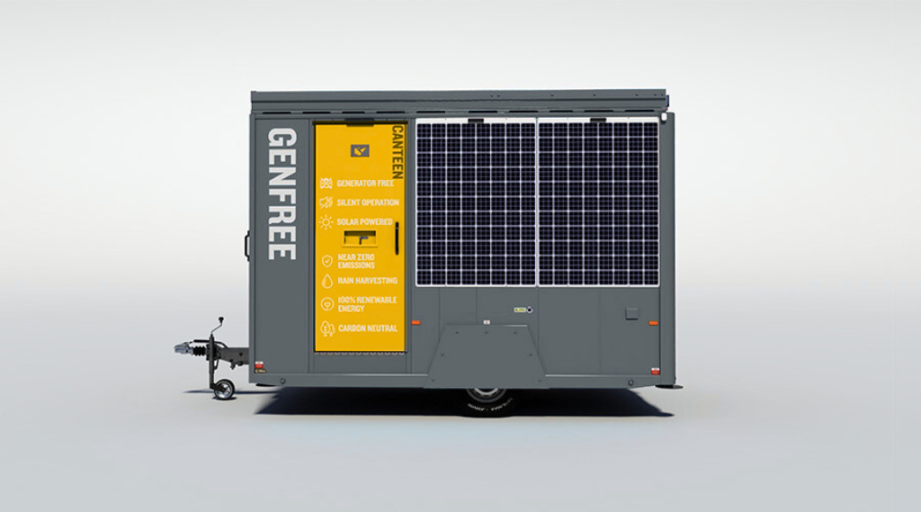 A portable generator trailer with solar panels and a yellow label highlighting features like generator free, silent operation, solar powered, near zero emissions, rain harvesting, renewable energy, and carbon neutral.