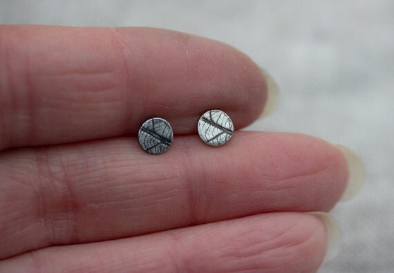 Tiny handmade stud earrings with skeleton leaf pattern