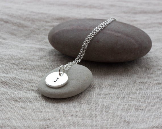 Silver circle pendant with stamped J letter on silver chain