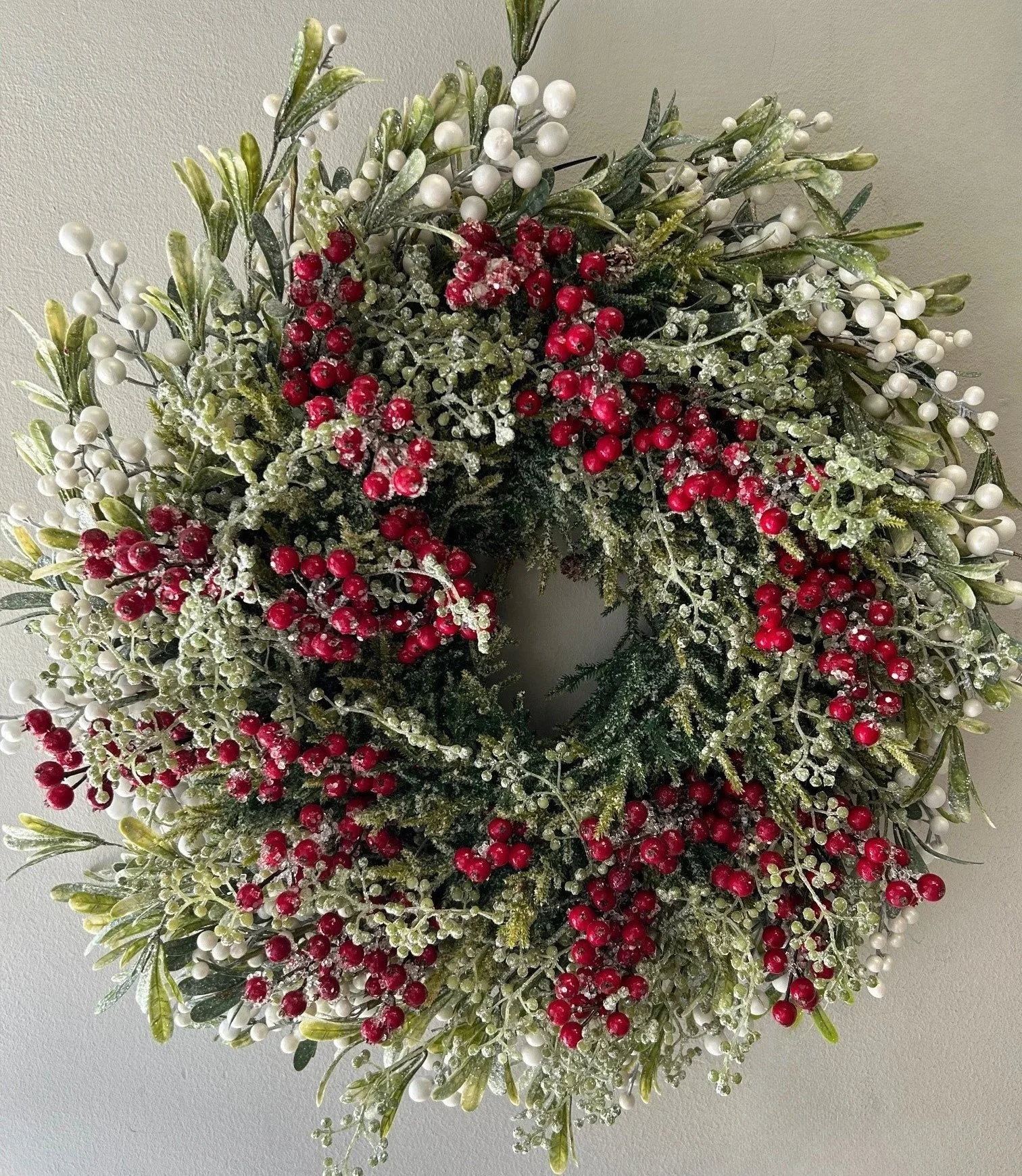 28" Mistletoe and red berries wreath
$400
Pair available