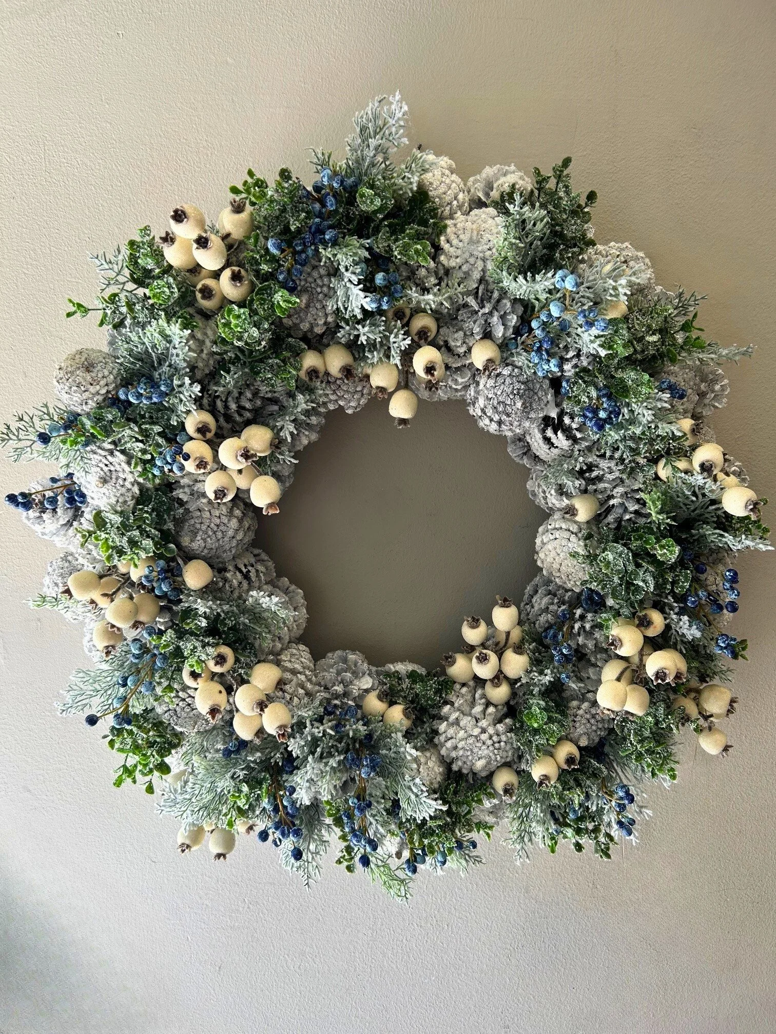 28" Snowy pinecone and berry wreath
$435
Pair available