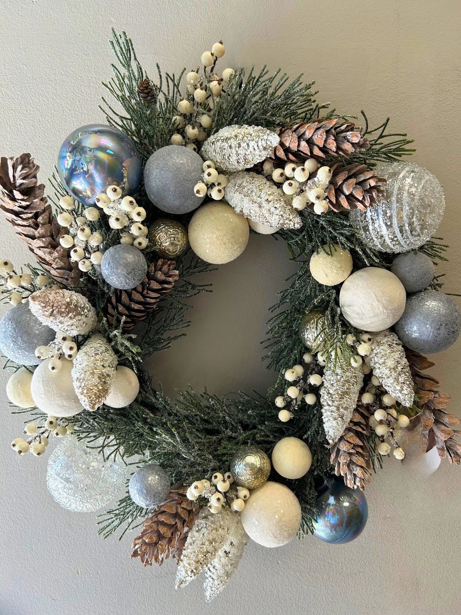 24" Frosted pinecone and silver ball wreath
$575
Pair available
