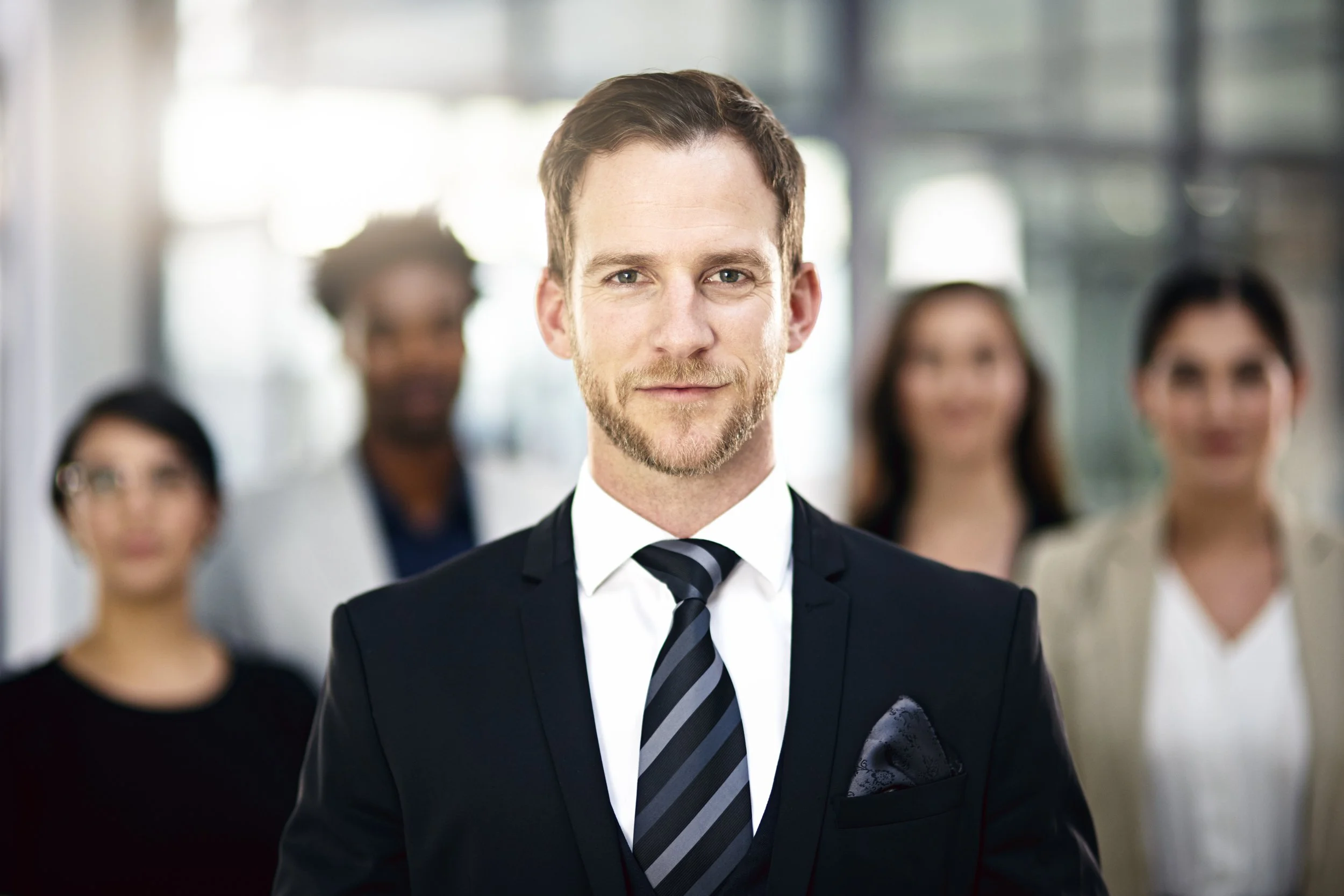 corporate confidence cropped portrait of a executive group