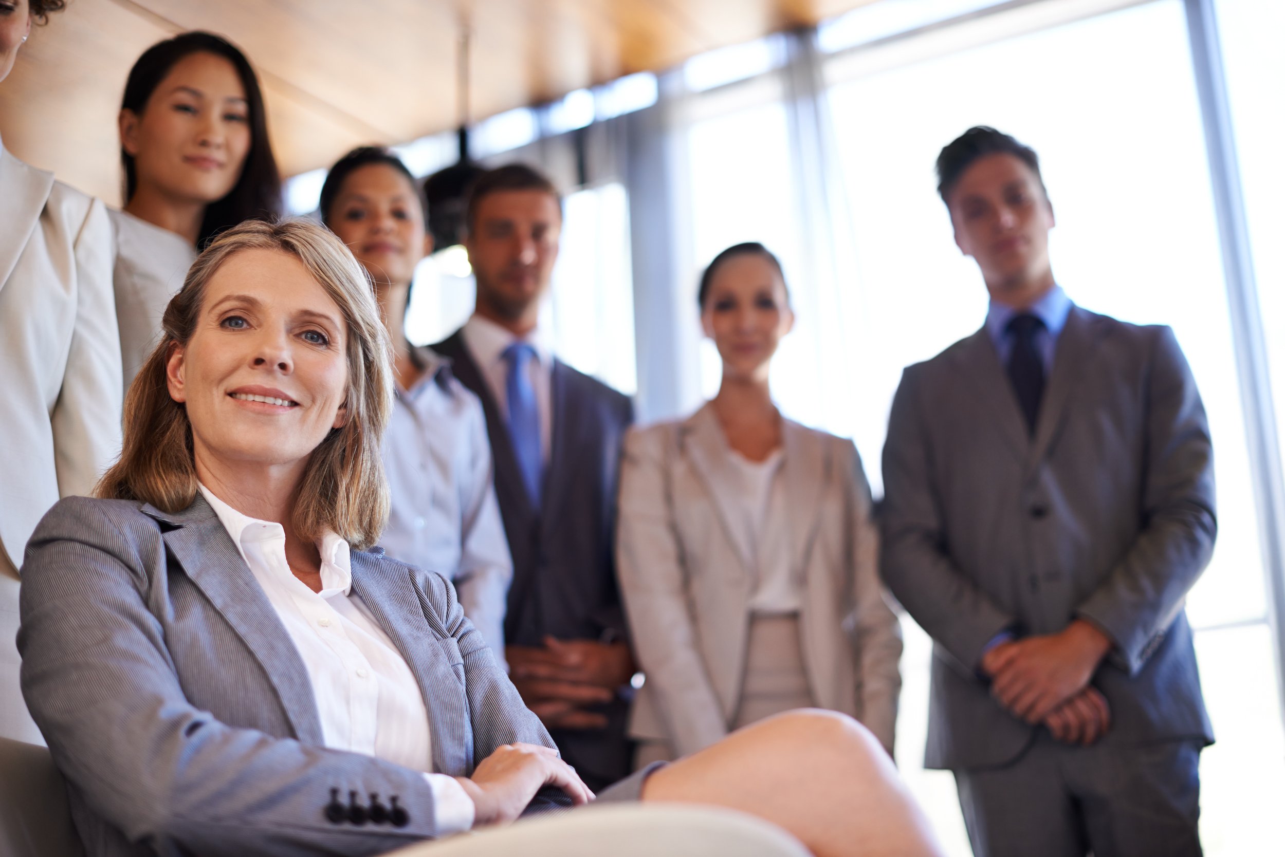 smiling professionals ready for business in modern suits