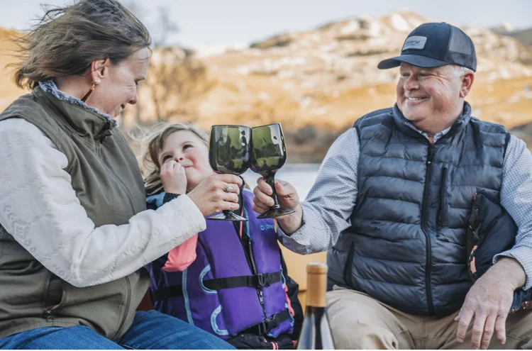 Matt Swan, Kari Swan, and daughter Sophie Joy Swan on the Yellowstone River near Livingston Montana, owners of Montana Classic Boat Tours and Swan's Fly Fishing