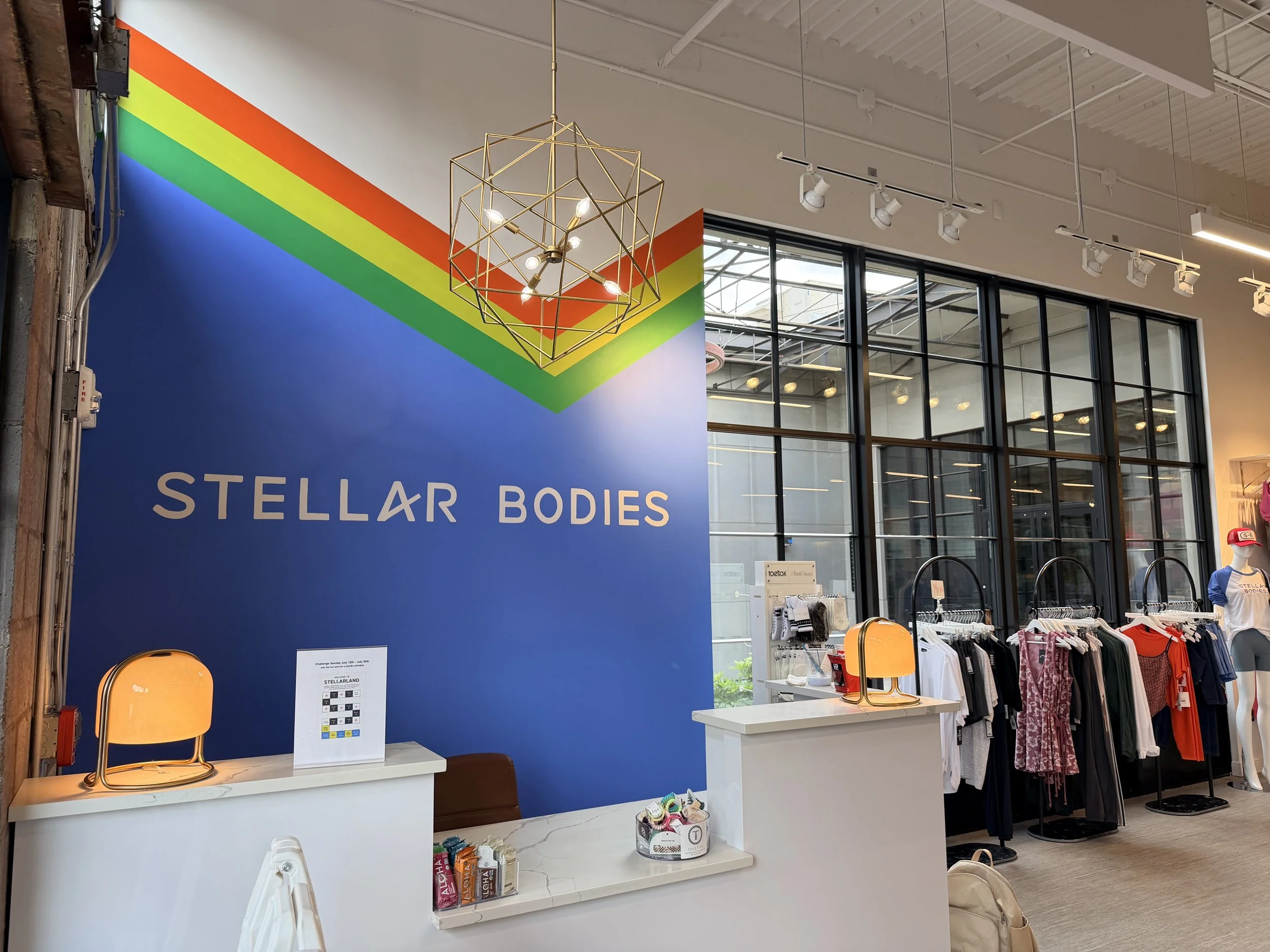 Front Desk logo wall at Stellar Bodies pilates studio at The Works, 2026