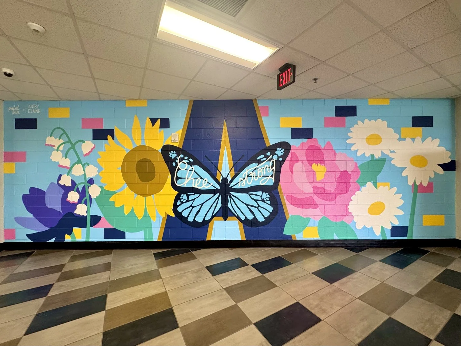 Apalachee High School hallway mural with flowers and a butterfly