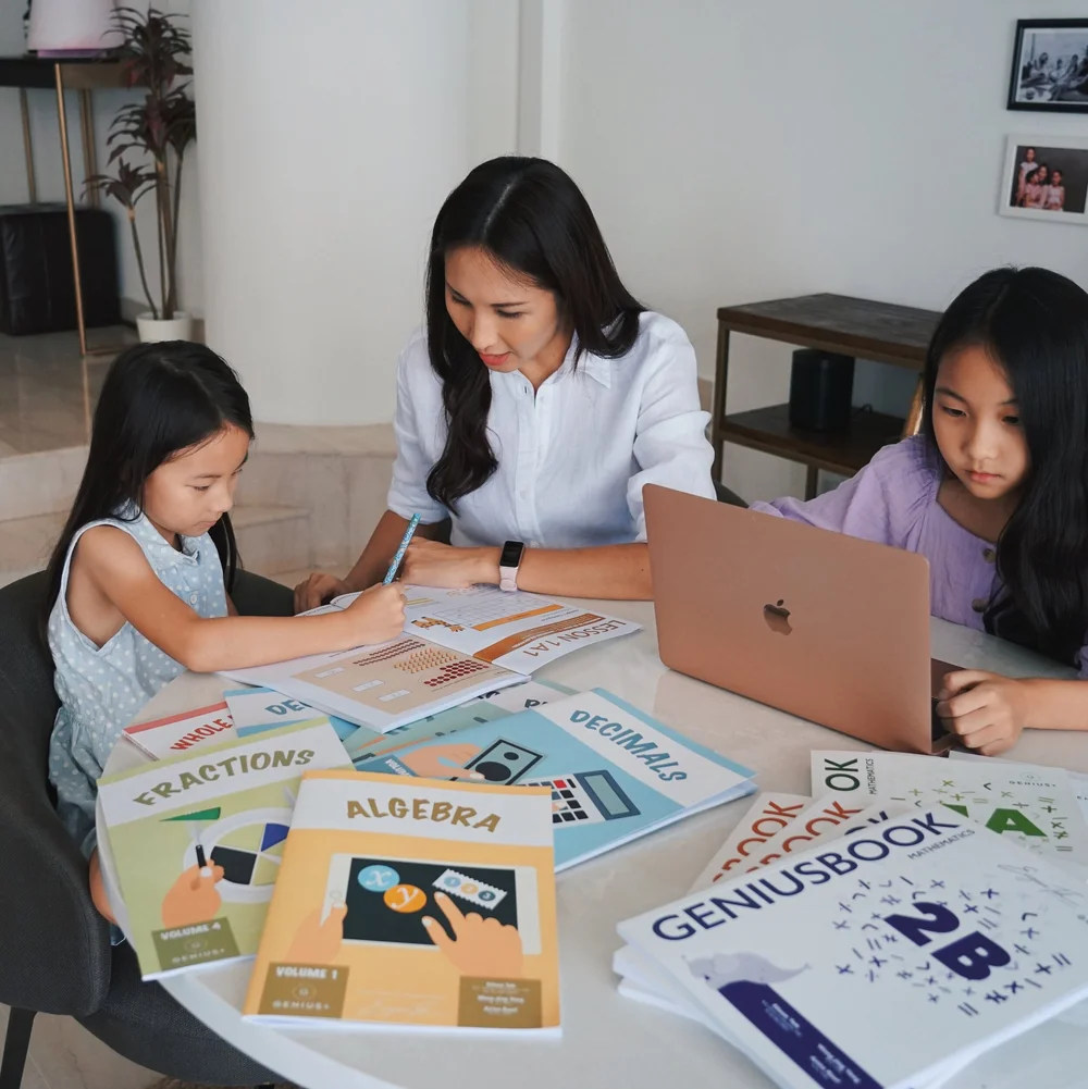Parent and children studying with GPA materials