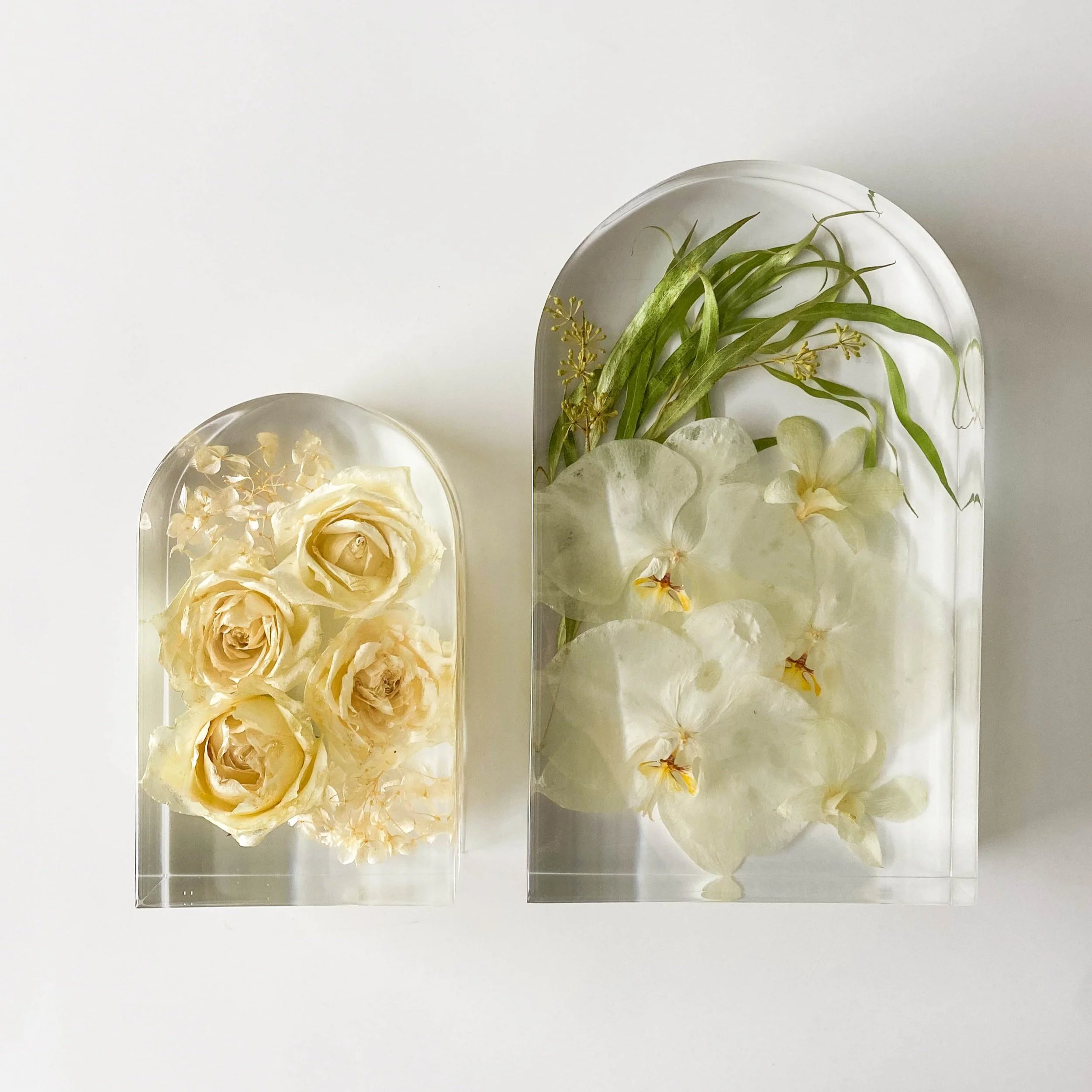 Shows our small and large arch shape - these look almost like tall arches windows! The small resin block includes white roses and the large is filled with beautiful white orchids and some accent greenery.