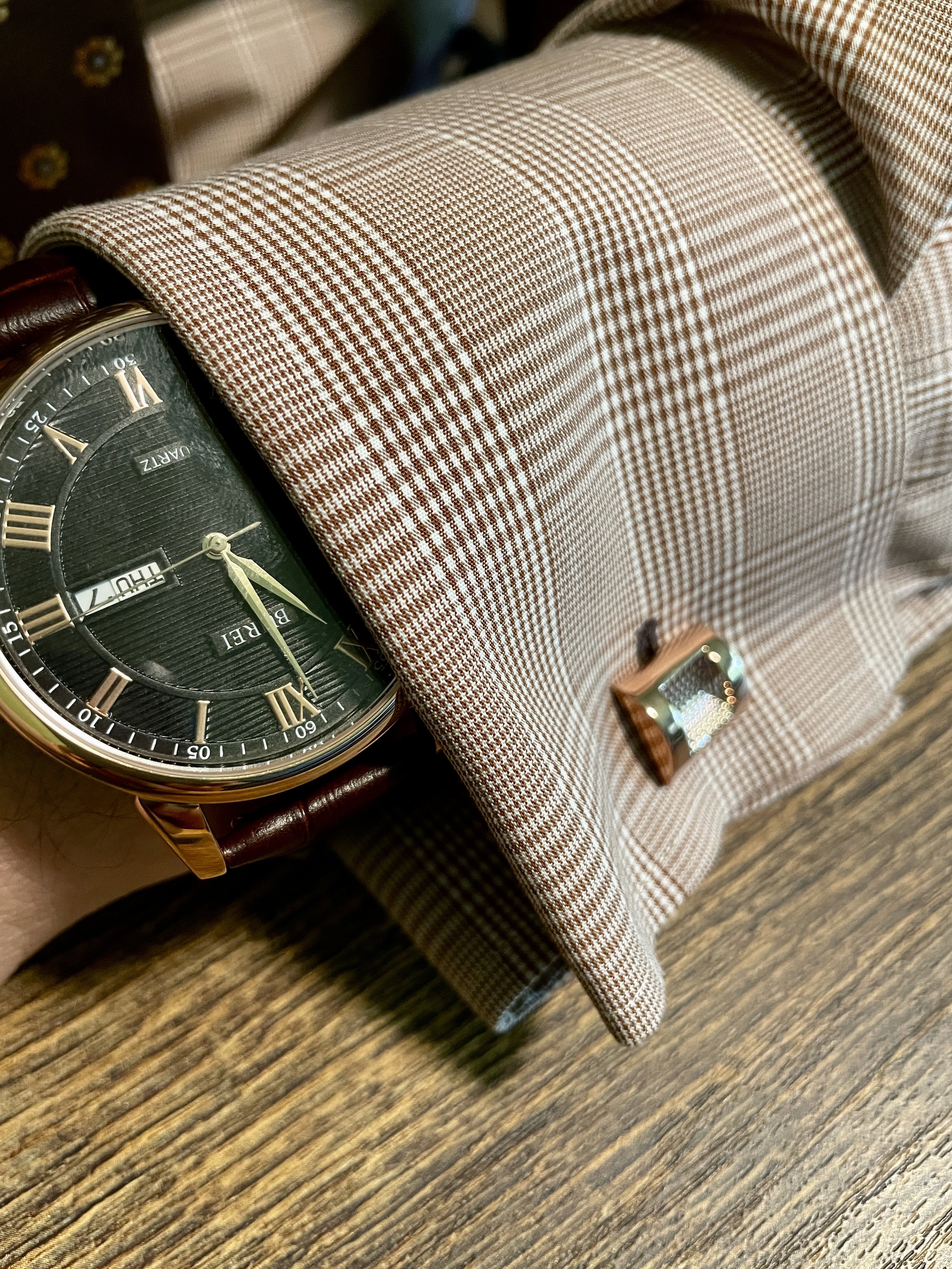 Select accessories that enhance a complete look, not detract from it. Here, its complementary rose gold to weave in with the browns.