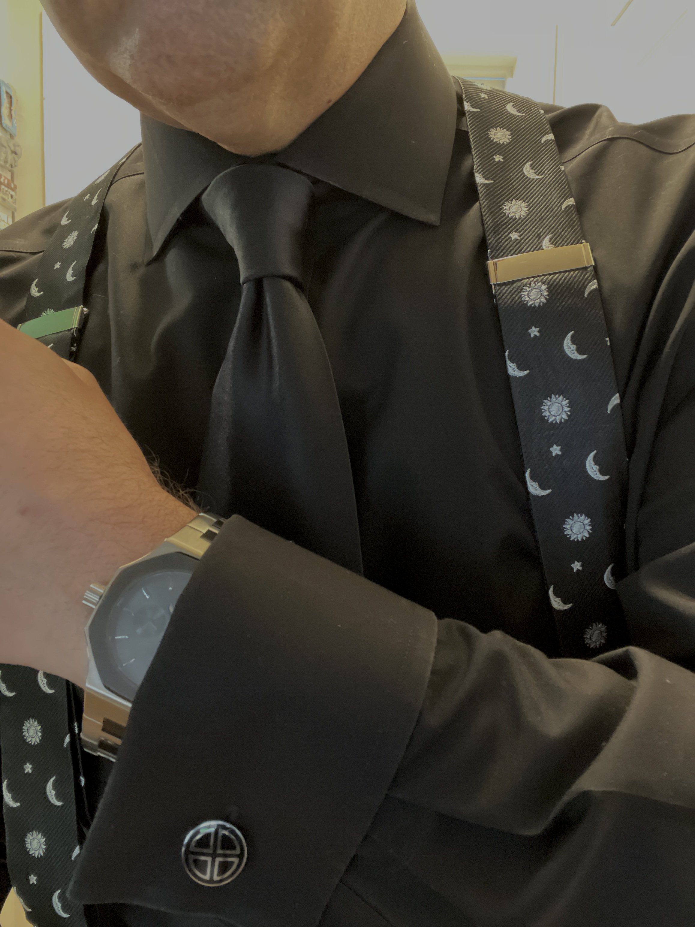 A unique watch that tracks the phases of the moon by Arkai/Trendhim paired with moon themed braces.