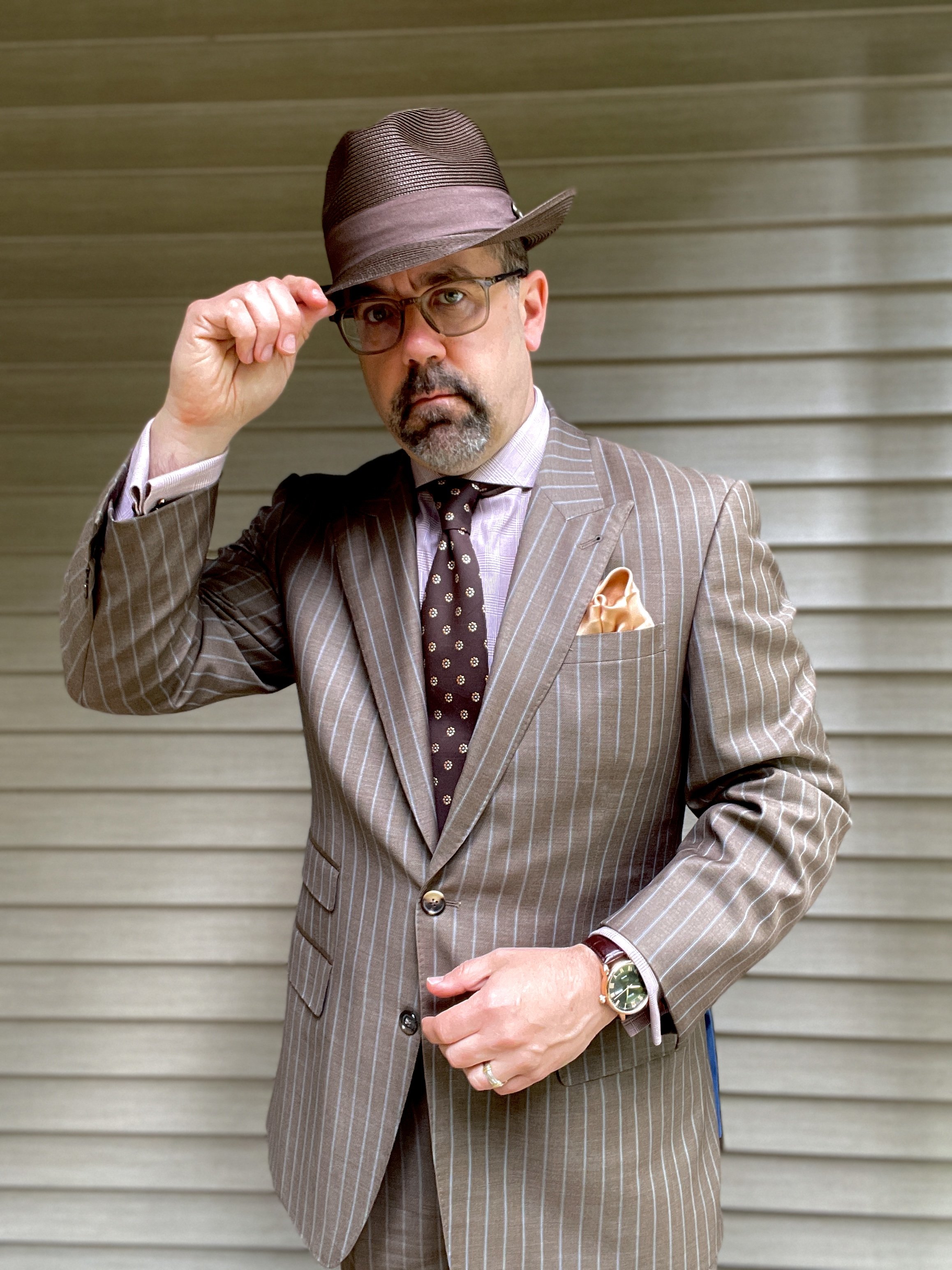 If you have never considered a fedora, try one like this beauty from Bruno Capelo. Defintely a memorable touch.