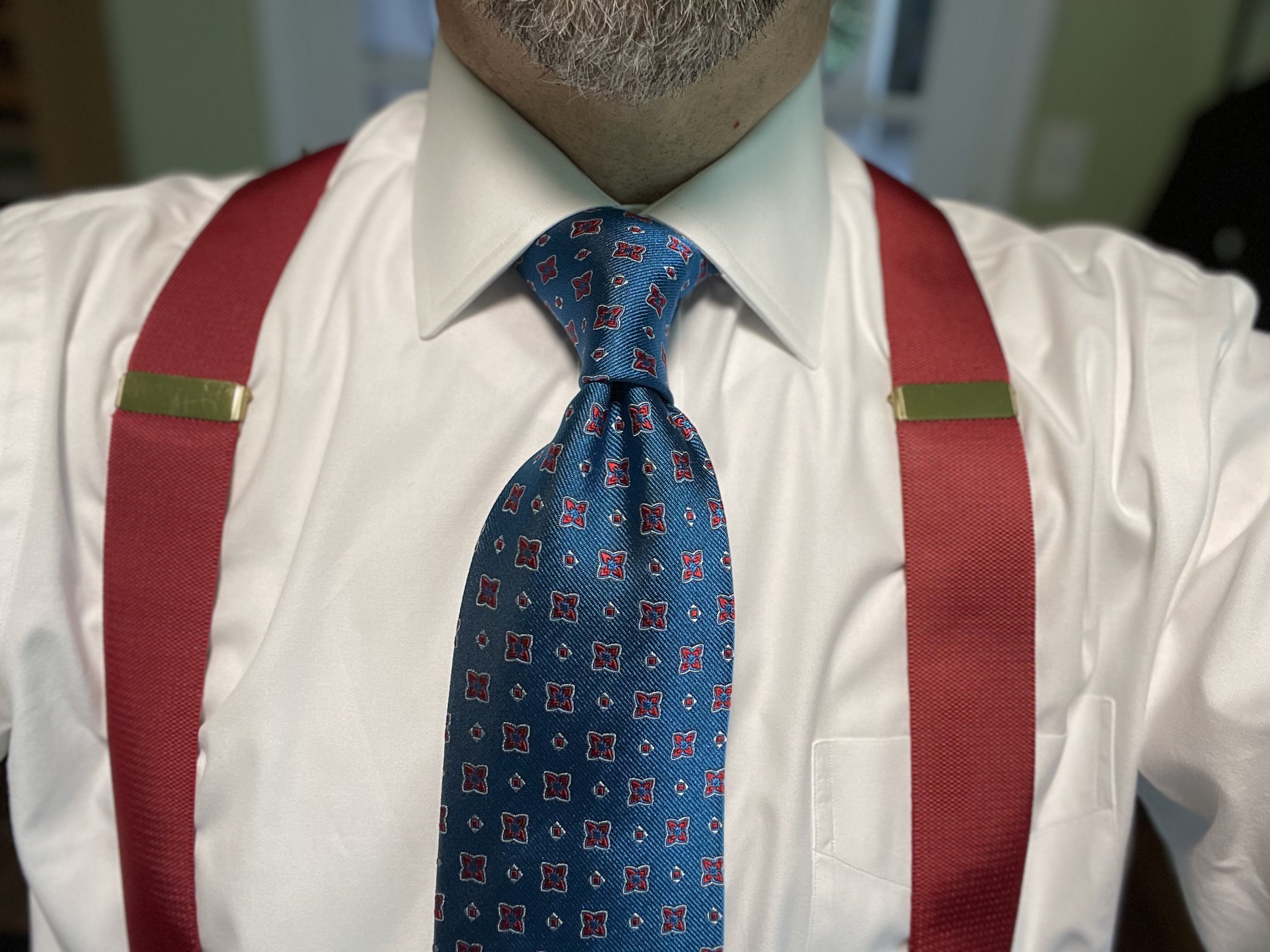 With wider ties that produce thicker knots, I tend to stick with knots like the Full- or Half-Windsor, or Double-Four-In-Hand (Cavendish).