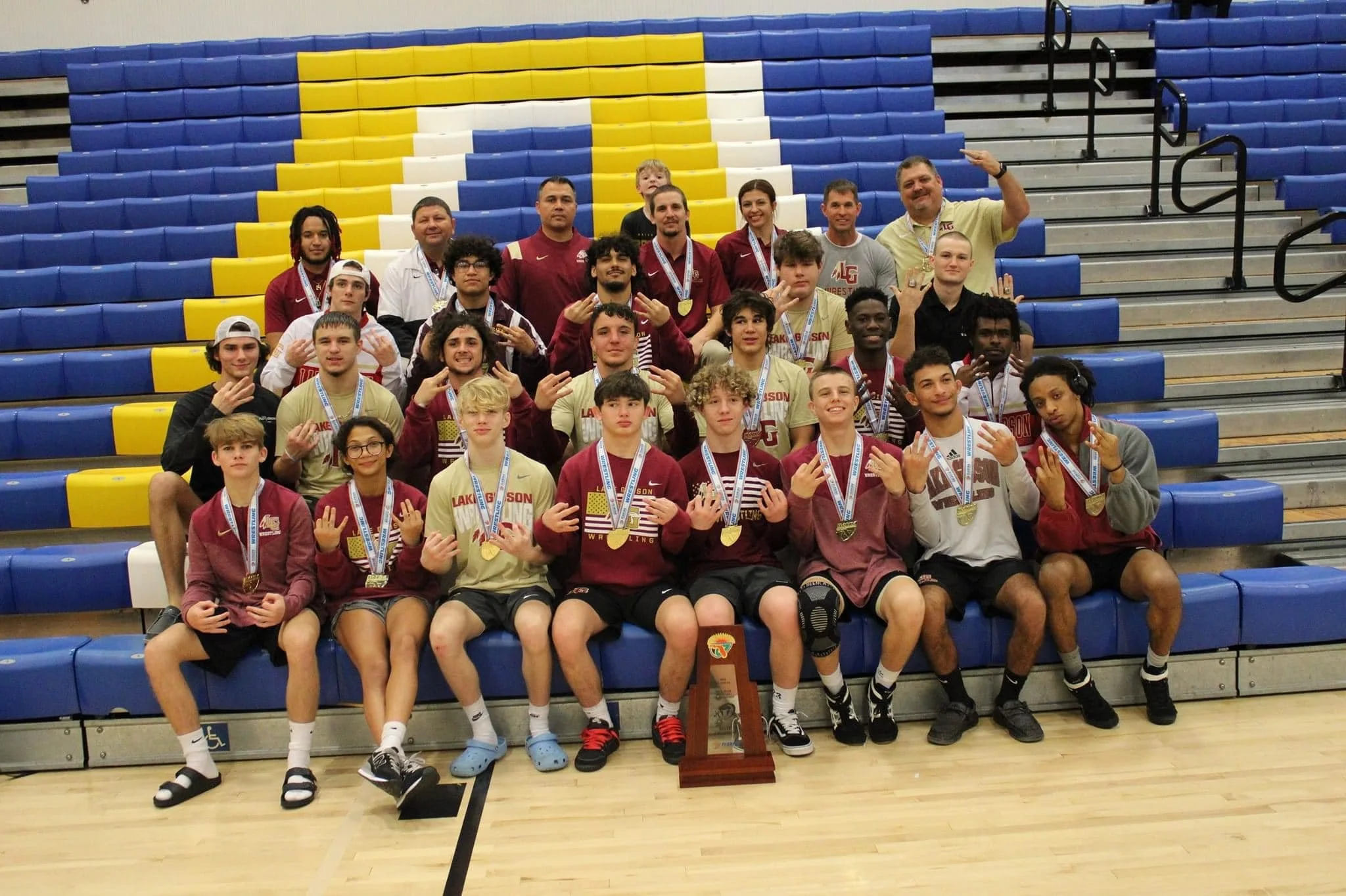 Lake Gibson uses team effort to win fifth state duals title
