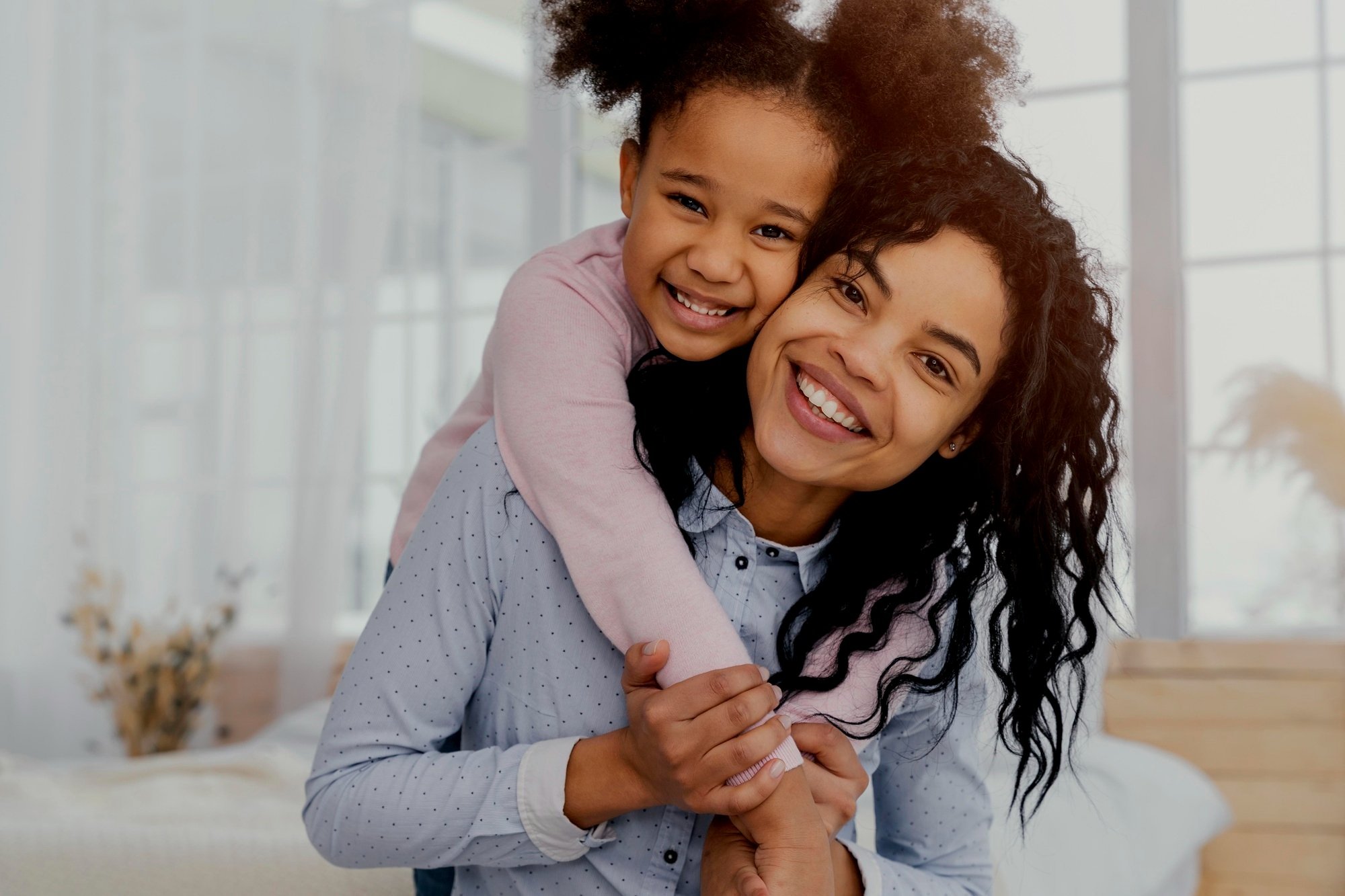 front-view-mother-playing-home-with-her-daughter.jpg