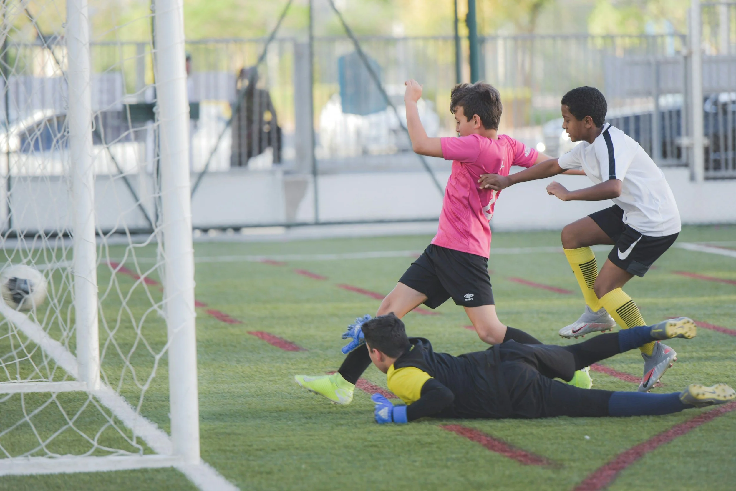 kids playing soccer in an article about over-scheduling one's kids