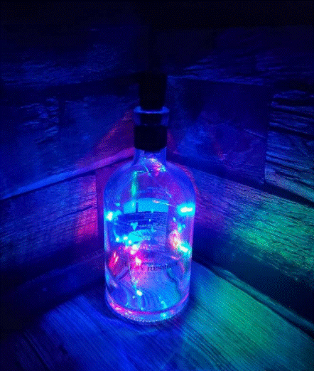 Lighting Up Your Space with Upcycled Chic: The Multi-Colored LED Liquor Bottle Lamp