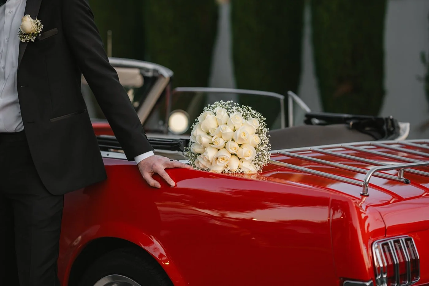bride and groom portrait with a ford mustang classic car