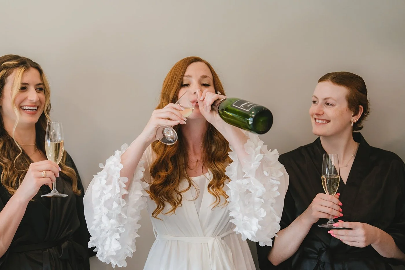 bride and her bridesmaids celebrating