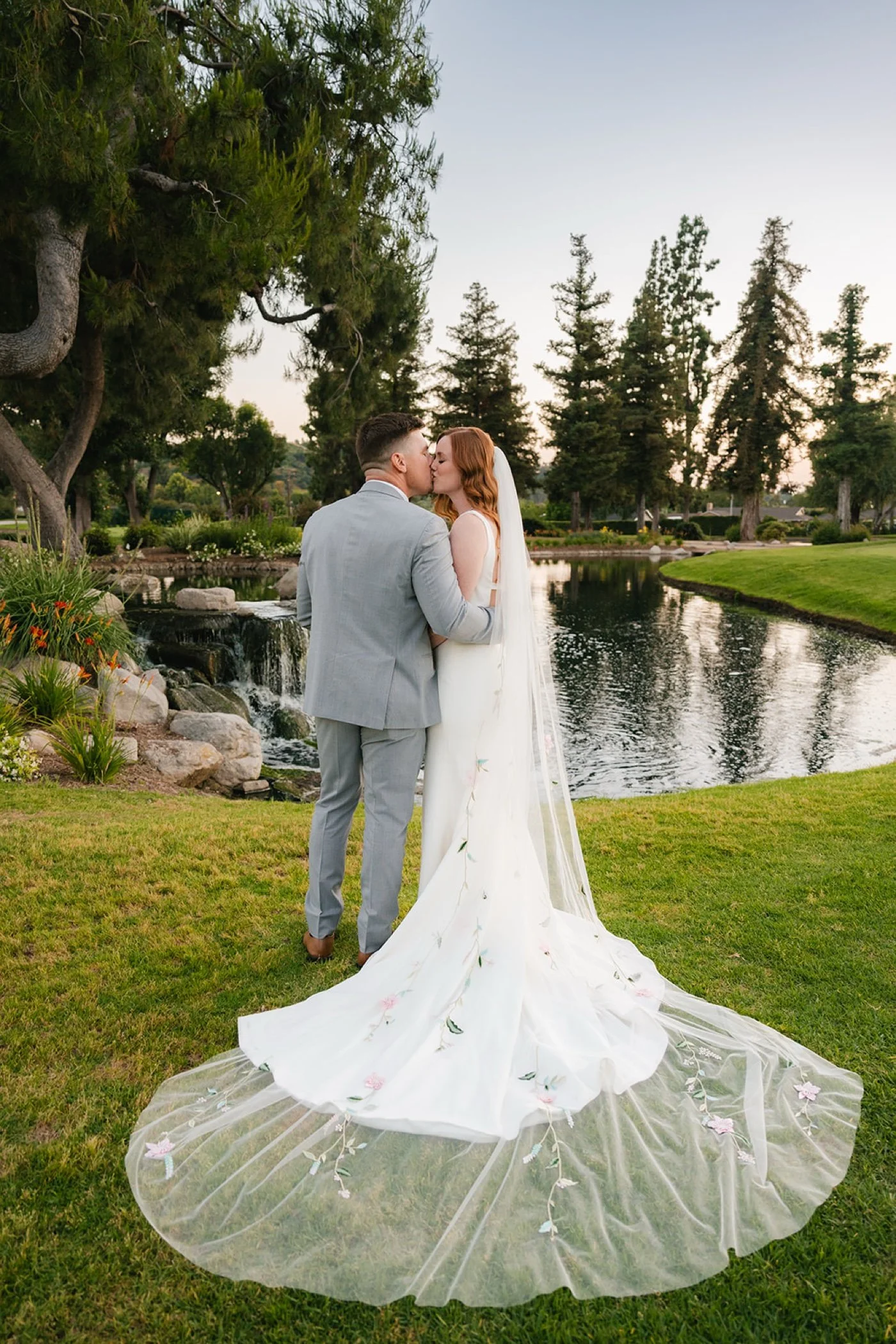 bride and groom taking portraits at their glendora country club wedding