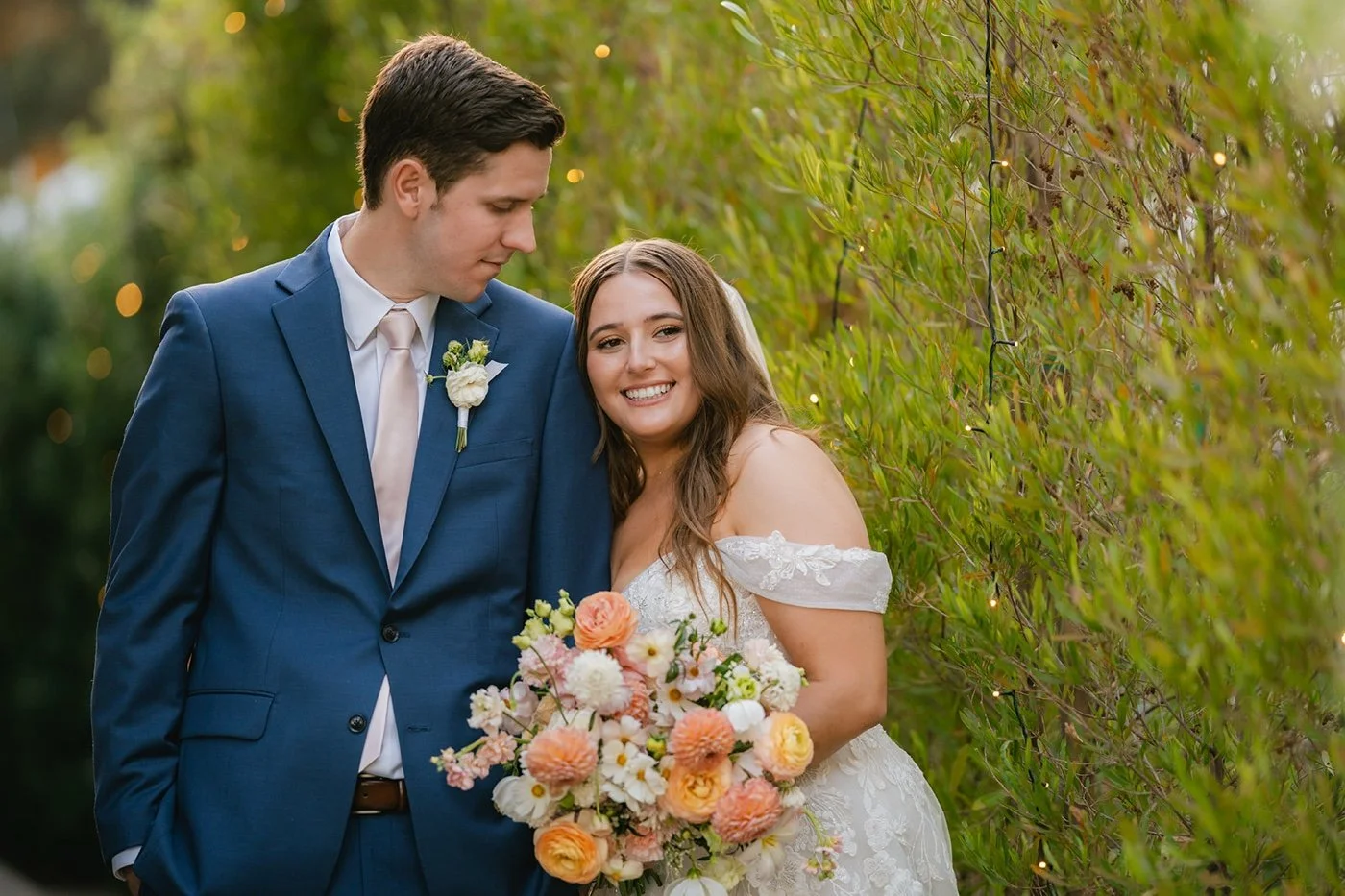 bride and groom taking portraits at their backyard wedding in los angeles