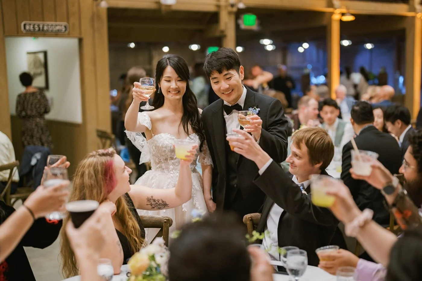 bride and groom greeting their guests at their barn wedding at camarillo ranch