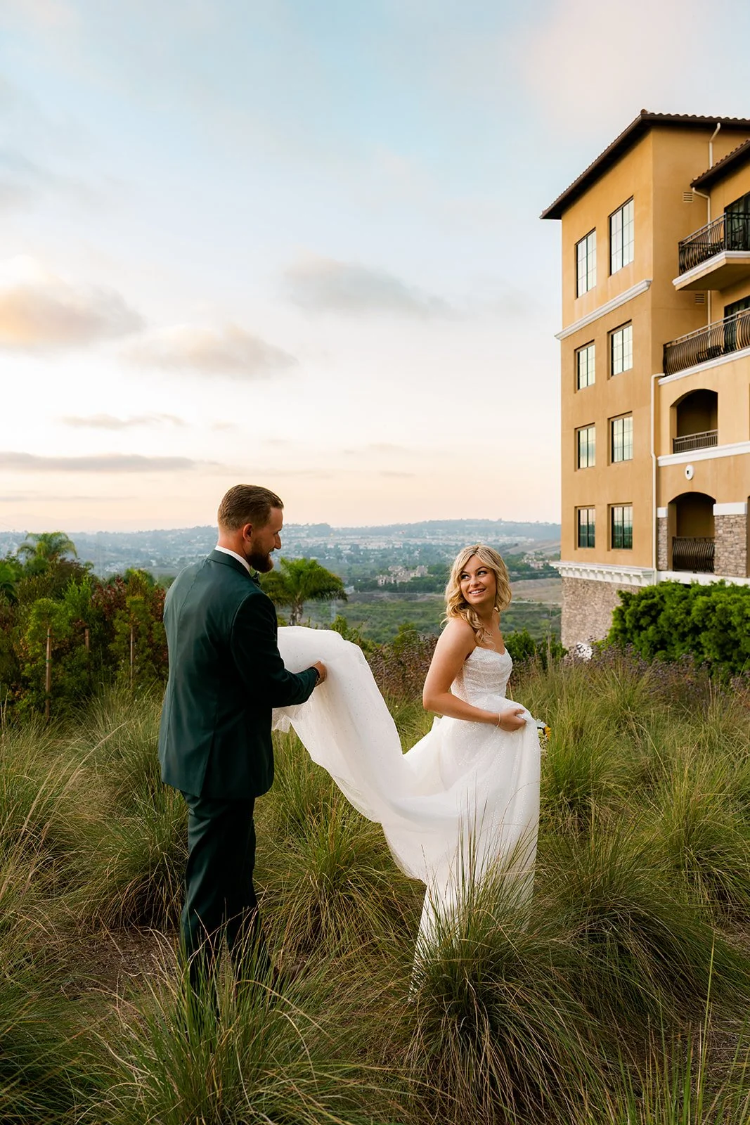 bride and groom taking portraits at sunset at their los angeles wedding