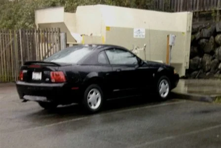 black mustang parked outside assisted living facility