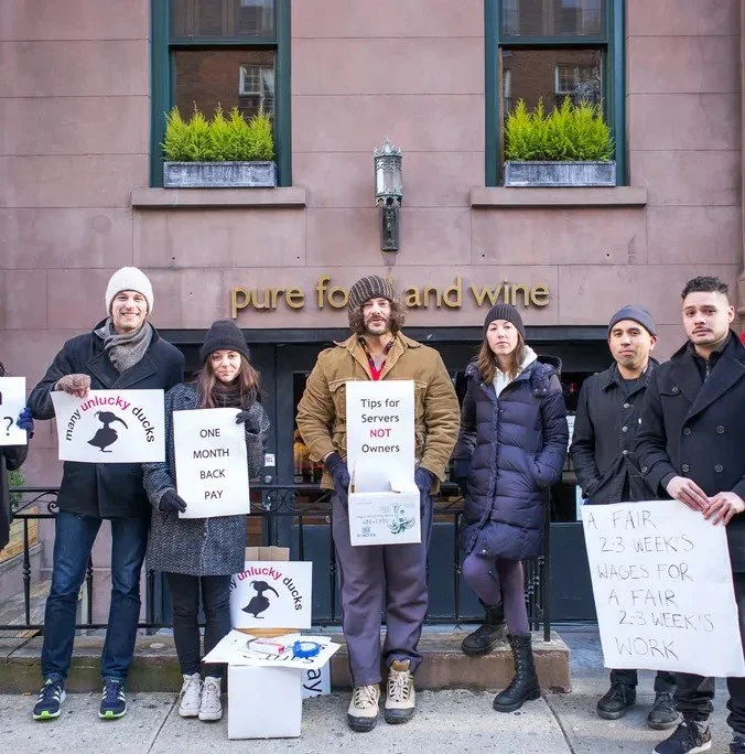 staff picketing the restaurant for back pay 